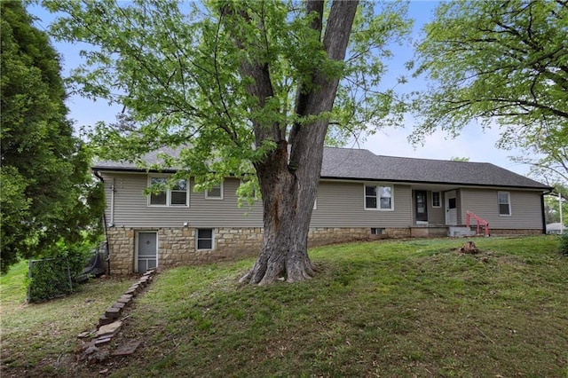 2111 Lombardy Dr, Kansas City, KS 66102 - view of front facade with a front lawn and stone siding