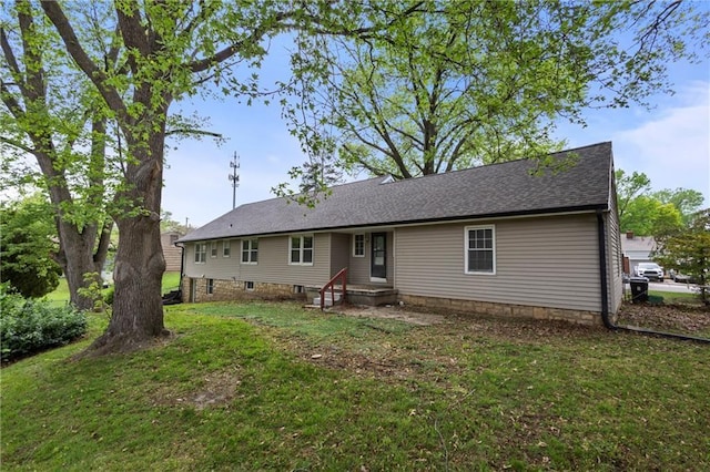 2111 Lombardy Dr, Kansas City, KS 66102 - back of house with a yard