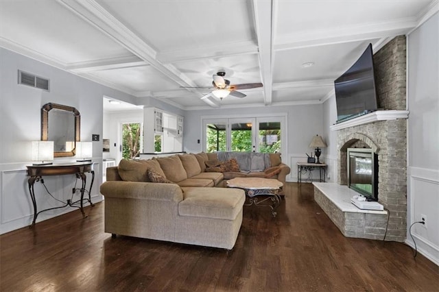 15320 W 92nd Pl, Lenexa, KS 66219 - living area with a ceiling fan, dark wood-style flooring, beam ceiling, a brick fireplace, and coffered ceiling