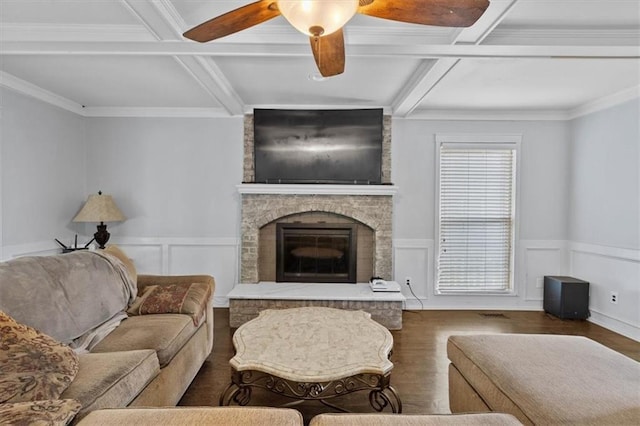 15320 W 92nd Pl, Lenexa, KS 66219 - living room featuring wood finished floors, ceiling fan, beam ceiling, a fireplace, and wainscoting