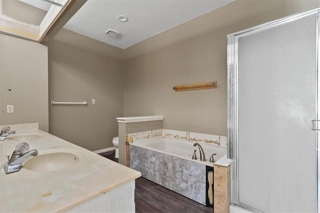 15320 W 92nd Pl, Lenexa, KS 66219 - bathroom with wood finished floors, a bath, a stall shower, and double vanity