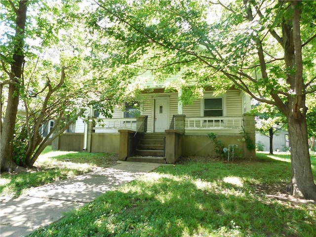 425 N Washington St, Nevada, MO 64772 - obstructed view of property featuring a porch