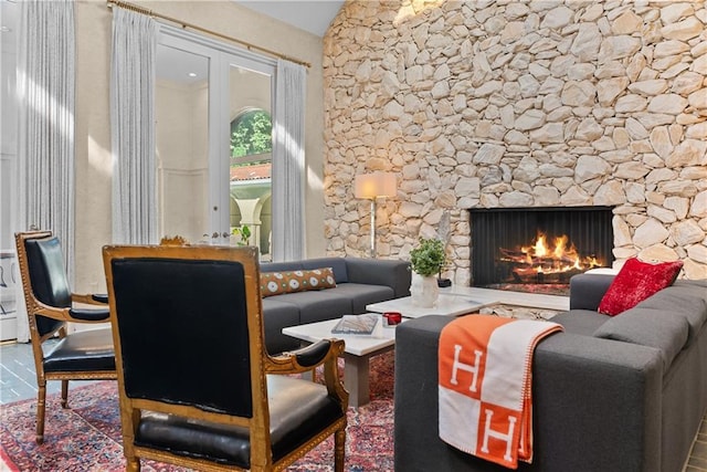 5212 W 98th Ter, Overland Park, KS 66207 - sitting room featuring a warm lit fireplace and lofted ceiling