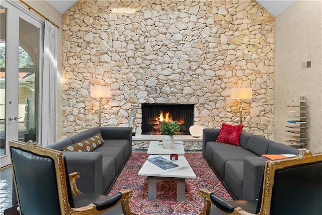 5212 W 98th Ter, Overland Park, KS 66207 - living area with vaulted ceiling, a lit fireplace, and french doors