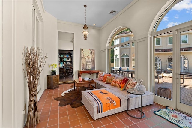 5212 W 98th Ter, Overland Park, KS 66207 - living room with tile patterned floors, a high ceiling, and ornamental molding