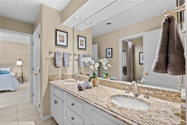 5212 W 98th Ter, Overland Park, KS 66207 - full bathroom featuring double vanity, ensuite bathroom, and tile patterned floors
