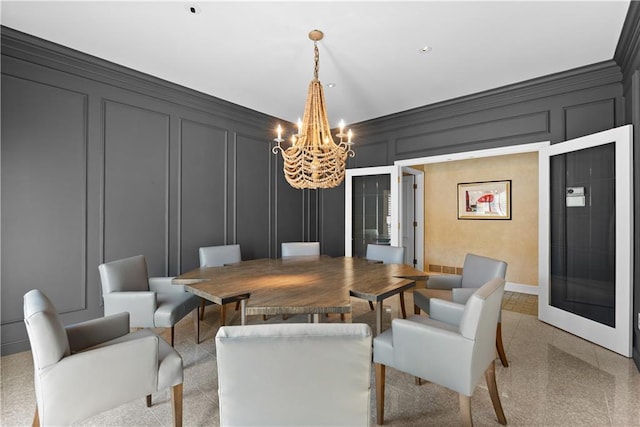 5212 W 98th Ter, Overland Park, KS 66207 - dining room featuring a decorative wall and a chandelier