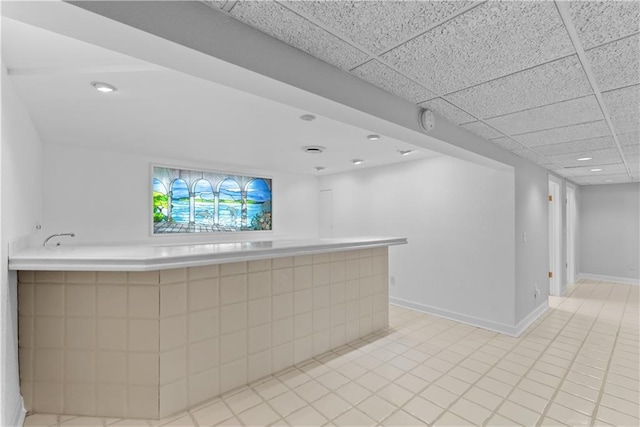 5212 W 98th Ter, Overland Park, KS 66207 - bar featuring light tile patterned flooring and a paneled ceiling