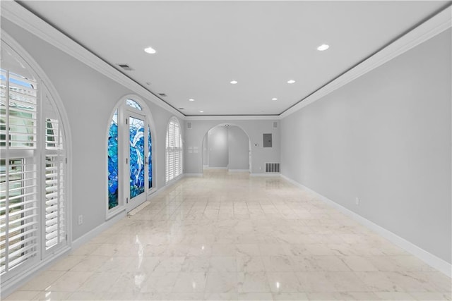 5212 W 98th Ter, Overland Park, KS 66207 - spare room featuring ornamental molding, arched walkways, recessed lighting, and light marble finish floors