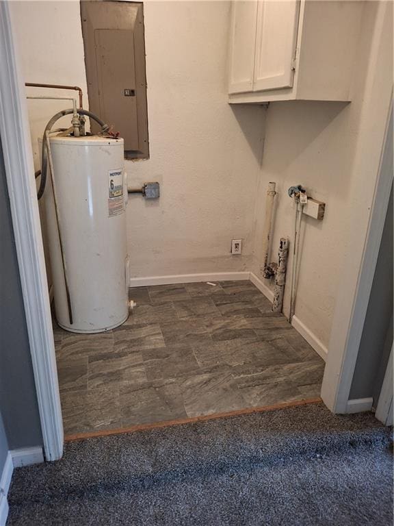 608 N Cedar St, Ottawa, KS 66067 - laundry area with water heater, electric panel, and cabinet space