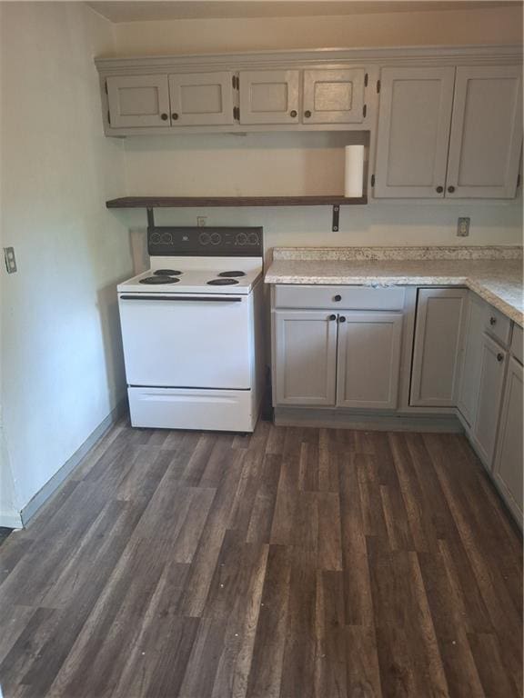 608 N Cedar St, Ottawa, KS 66067 - kitchen featuring electric range, light countertops, and dark wood-type flooring