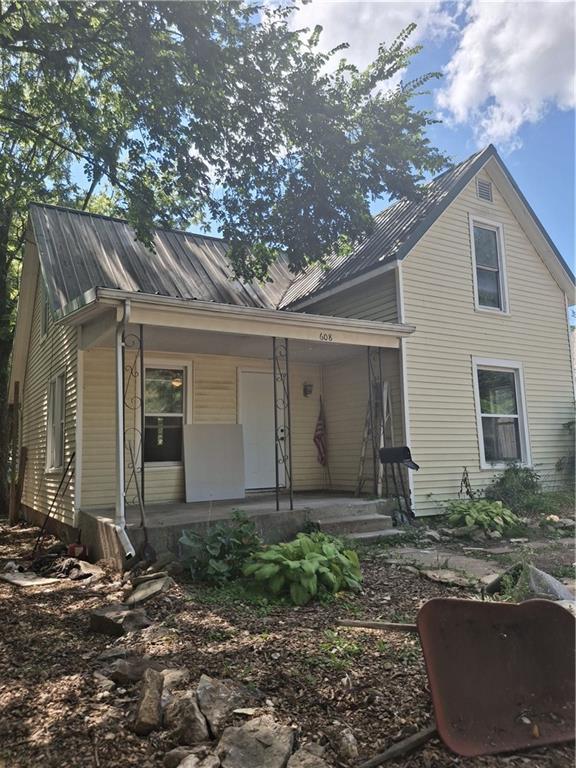 608 N Cedar St, Ottawa, KS 66067 - rear view of property with covered porch and a metal roof