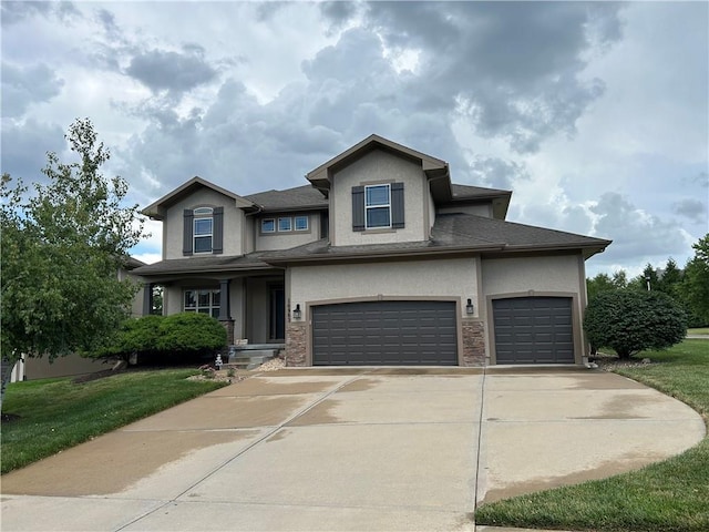 10963 S Carbondale St, Olathe, KS 66061 - view of front of home featuring stucco siding, concrete driveway, a front yard, and an attached garage
