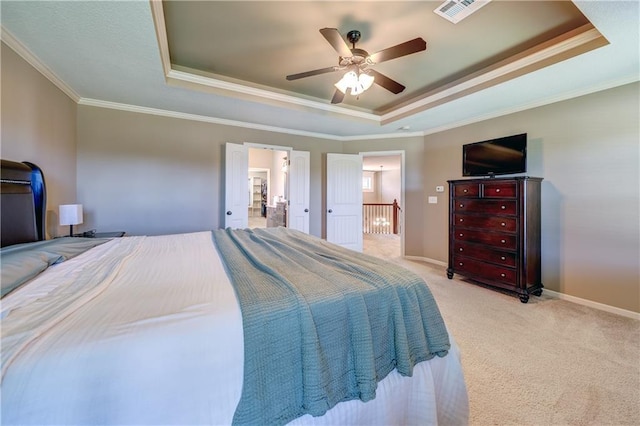 10963 S Carbondale St, Olathe, KS 66061 - bedroom with a raised ceiling, crown molding, carpet floors, a ceiling fan, and connected bathroom