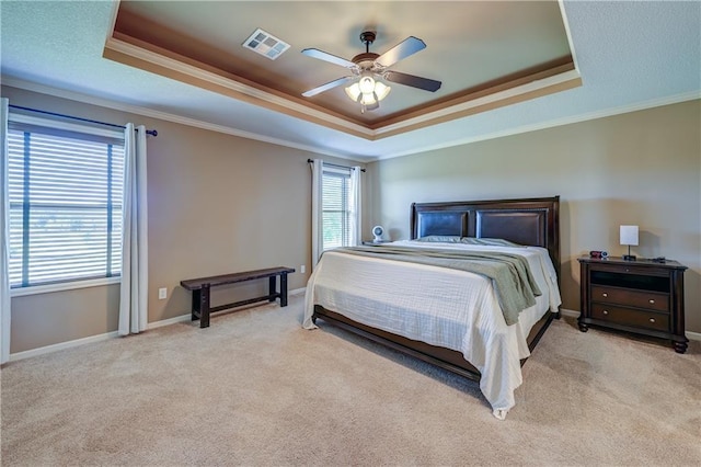 10963 S Carbondale St, Olathe, KS 66061 - bedroom with a raised ceiling, crown molding, multiple windows, and light carpet