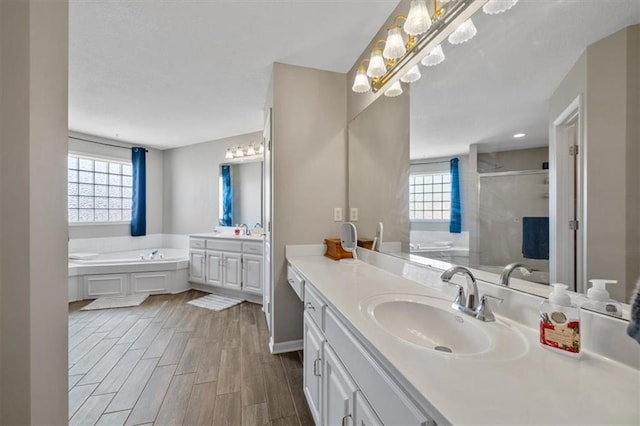 2312 SW Post Oak Ct, Lees Summit, MO 64082 - bathroom featuring a garden tub, plenty of natural light, vanity, and a stall shower