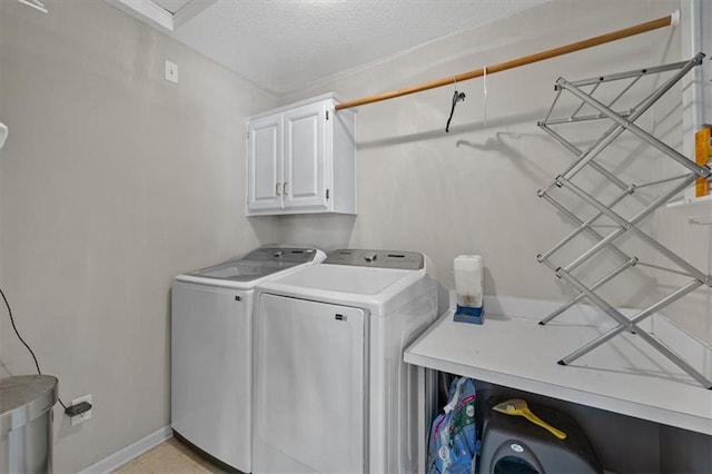 2312 SW Post Oak Ct, Lees Summit, MO 64082 - laundry room featuring cabinet space, washing machine and dryer, and a textured ceiling
