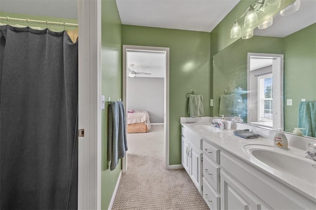 2312 SW Post Oak Ct, Lees Summit, MO 64082 - ensuite bathroom featuring double vanity and baseboards