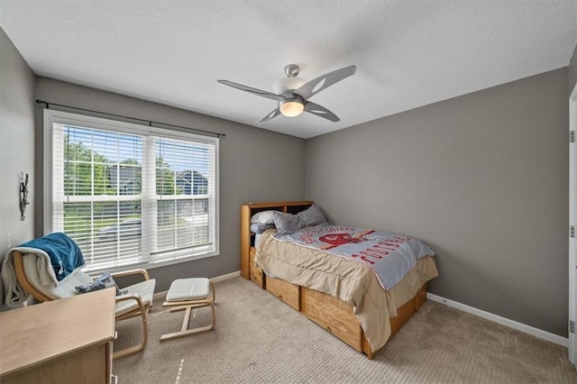 2312 SW Post Oak Ct, Lees Summit, MO 64082 - carpeted bedroom featuring a ceiling fan and a textured ceiling