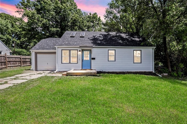 3029 S 9th Pl, Kansas City, KS 66103 - view of front of property with concrete driveway, an attached garage, and roof with shingles