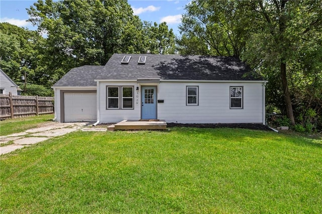 3029 S 9th Pl, Kansas City, KS 66103 - view of front of property with driveway, a garage, and roof with shingles