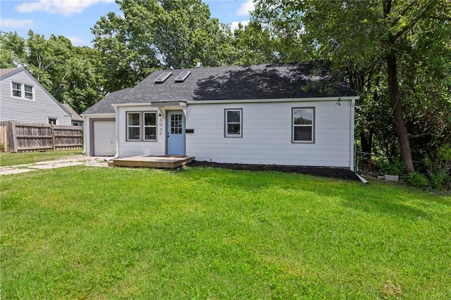 3029 S 9th Pl, Kansas City, KS 66103 - view of front facade with driveway, roof with shingles, a garage, and a deck