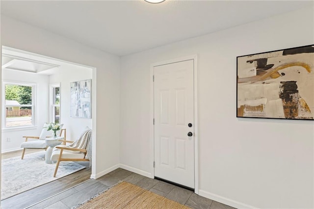 3029 S 9th Pl, Kansas City, KS 66103 - foyer entrance featuring baseboards and wood finished floors