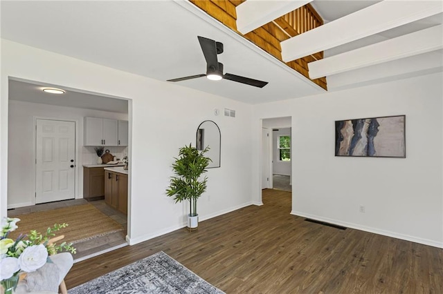 3029 S 9th Pl, Kansas City, KS 66103 - unfurnished living room with dark wood finished floors and a ceiling fan