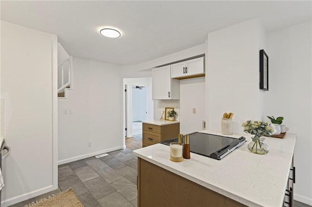 3029 S 9th Pl, Kansas City, KS 66103 - kitchen featuring white cabinetry and black electric cooktop
