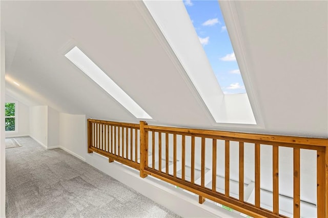 3029 S 9th Pl, Kansas City, KS 66103 - hallway with a skylight, carpet floors, and lofted ceiling