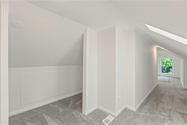 3029 S 9th Pl, Kansas City, KS 66103 - additional living space featuring carpet, vaulted ceiling, and a skylight