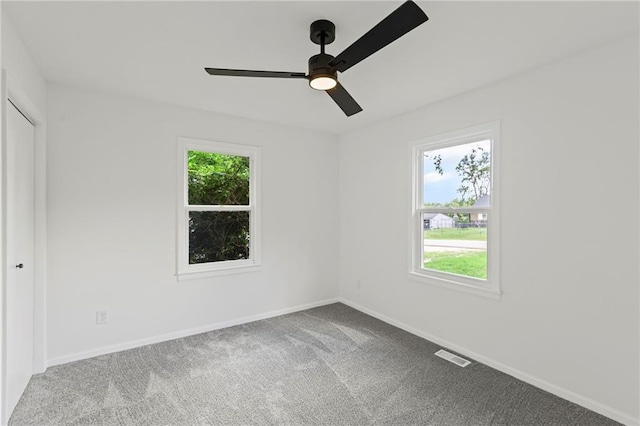 3029 S 9th Pl, Kansas City, KS 66103 - spare room featuring carpet floors and ceiling fan