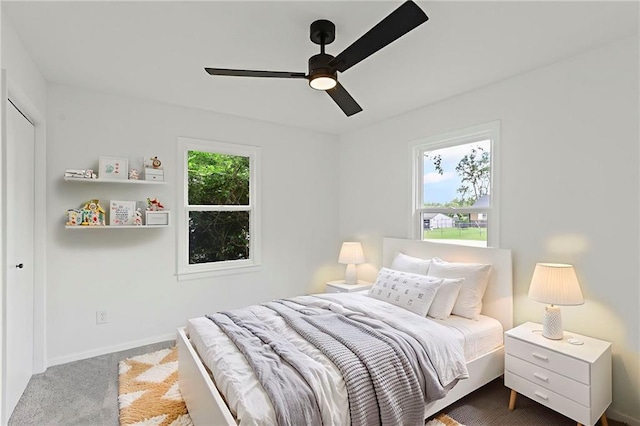 3029 S 9th Pl, Kansas City, KS 66103 - carpeted bedroom with baseboards and ceiling fan
