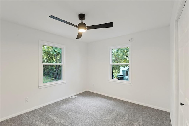 3029 S 9th Pl, Kansas City, KS 66103 - carpeted spare room with healthy amount of natural light and a ceiling fan