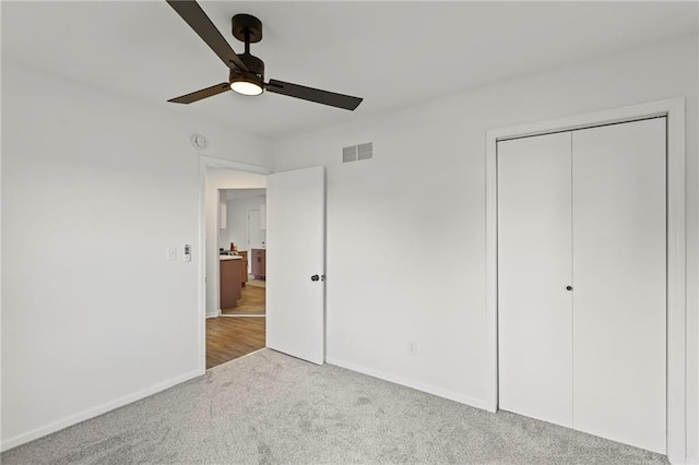 3029 S 9th Pl, Kansas City, KS 66103 - unfurnished bedroom with carpet flooring, a closet, and ceiling fan
