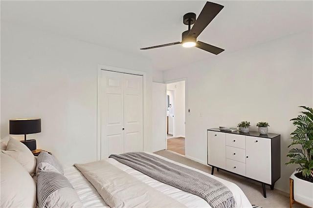 3029 S 9th Pl, Kansas City, KS 66103 - bedroom featuring light carpet, ceiling fan, and a closet