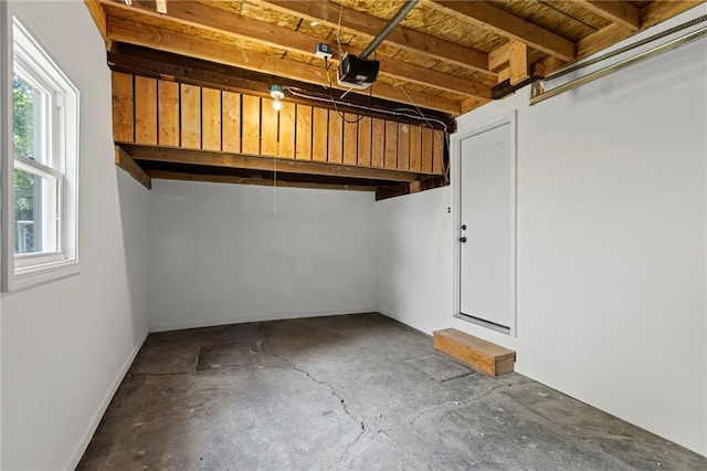 3029 S 9th Pl, Kansas City, KS 66103 - garage with a garage door opener and baseboards