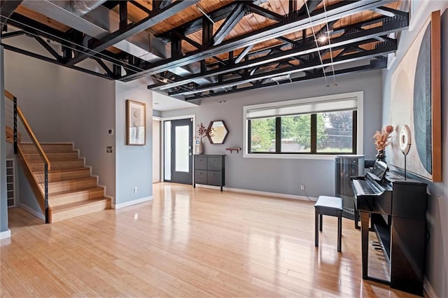 1303 W 47th St, Kansas City, MO 64112 - entryway with stairs and wood finished floors