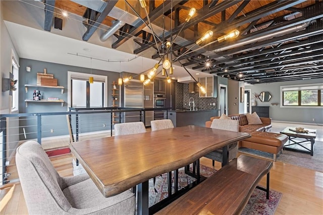 1303 W 47th St, Kansas City, MO 64112 - dining room with light wood-style flooring