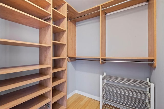 1303 W 47th St, Kansas City, MO 64112 - walk in closet featuring wood finished floors and heating unit