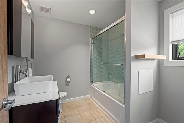 1303 W 47th St, Kansas City, MO 64112 - full bath with vanity, shower / bath combination with glass door, and tile patterned flooring