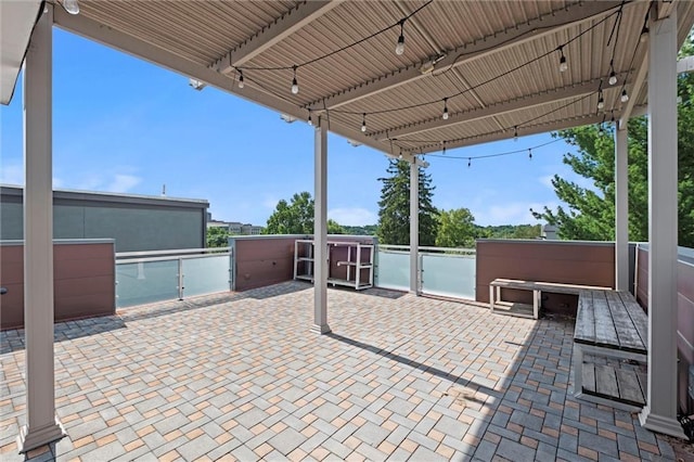1303 W 47th St, Kansas City, MO 64112 - view of patio / terrace featuring an outdoor kitchen