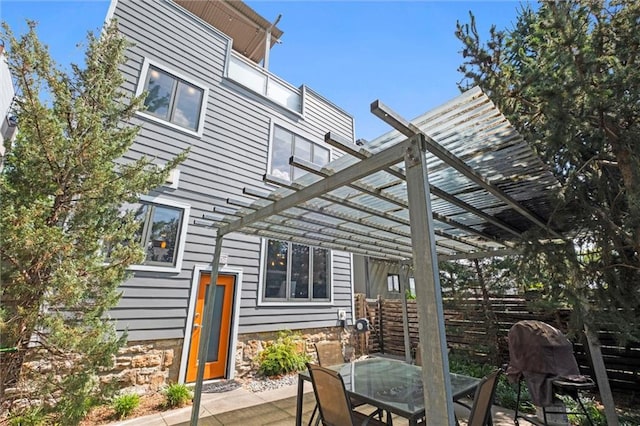 1303 W 47th St, Kansas City, MO 64112 - view of patio featuring a pergola and outdoor dining area
