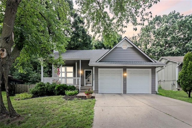 17507 E 35th Ter, Independence, MO 64055 - ranch-style home with an attached garage, covered porch, driveway, and roof with shingles