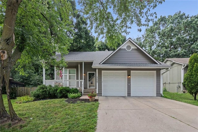 17507 E 35th Ter, Independence, MO 64055 - ranch-style home featuring an attached garage, concrete driveway, covered porch, and roof with shingles