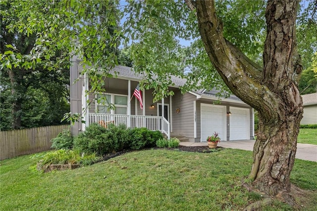 17507 E 35th Ter, Independence, MO 64055 - view of front of property with covered porch, a garage, driveway, and roof with shingles