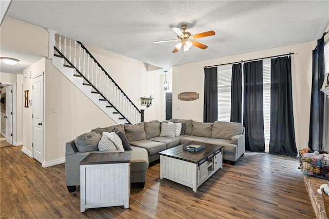 17507 E 35th Ter, Independence, MO 64055 - living area featuring ceiling fan, stairway, dark wood-style floors, and a textured ceiling