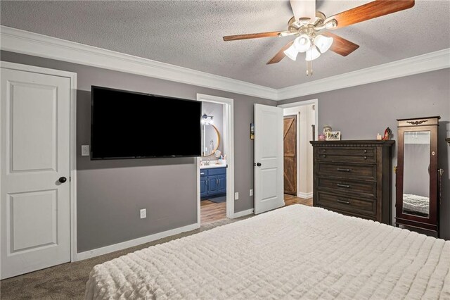17507 E 35th Ter, Independence, MO 64055 - bedroom featuring crown molding, a textured ceiling, a ceiling fan, and connected bathroom