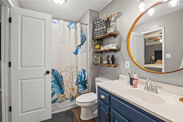 17507 E 35th Ter, Independence, MO 64055 - ensuite bathroom featuring a textured ceiling, vanity, wood finished floors, shower / bath combination with curtain, and a ceiling fan