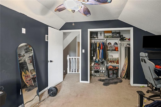 17507 E 35th Ter, Independence, MO 64055 - carpeted bedroom with vaulted ceiling, a textured ceiling, a closet, and a ceiling fan